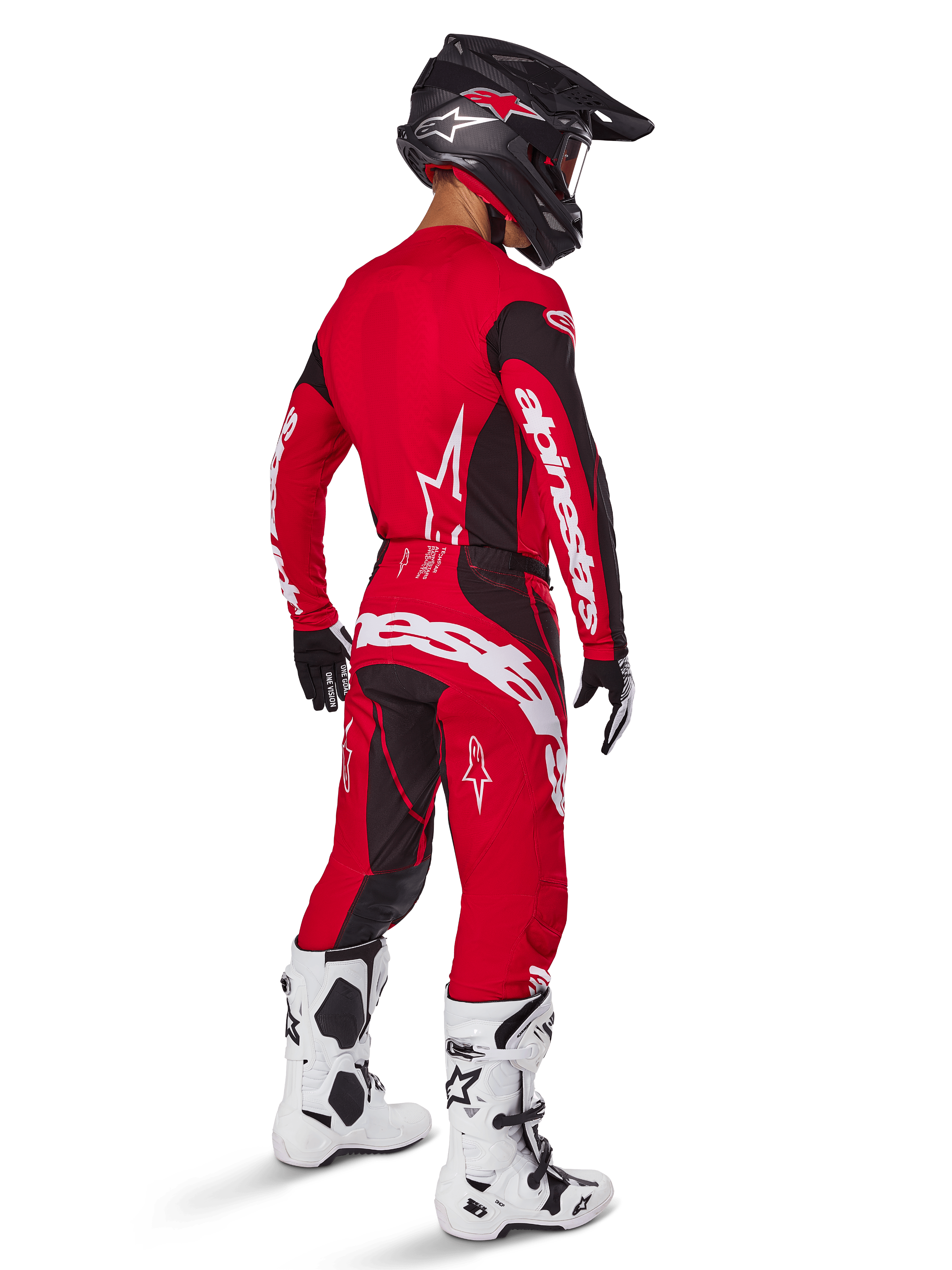 Alpinestars 2025 Techstar Dreem Pants, Motocross Pants, Bright Red and Black, worn by a rider from a rear perspective in a full racing kit with matching red jersey, black helmet, and white boots, featuring bold white Alpinestars branding and black stretch panels.