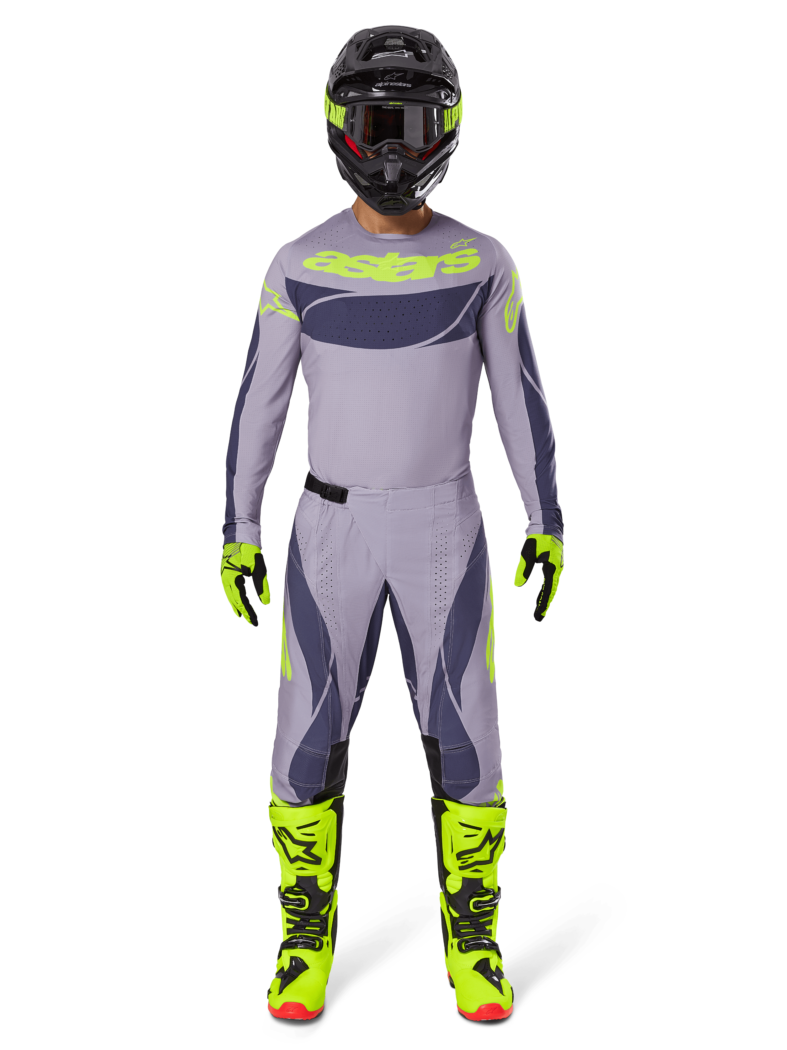 Motocross-Fahrer in kompletter Rennausrüstung, Alpinestars 2025 Techstar Dreem Hose in Grau und Dunkelgrau, passendes Trikot mit fluoreszierend gelbem Branding, schwarzer Helm, fluoreszierend gelbe Stiefel und Handschuhe, abgestimmtes Performance-Outfit für Offroad-Rennen