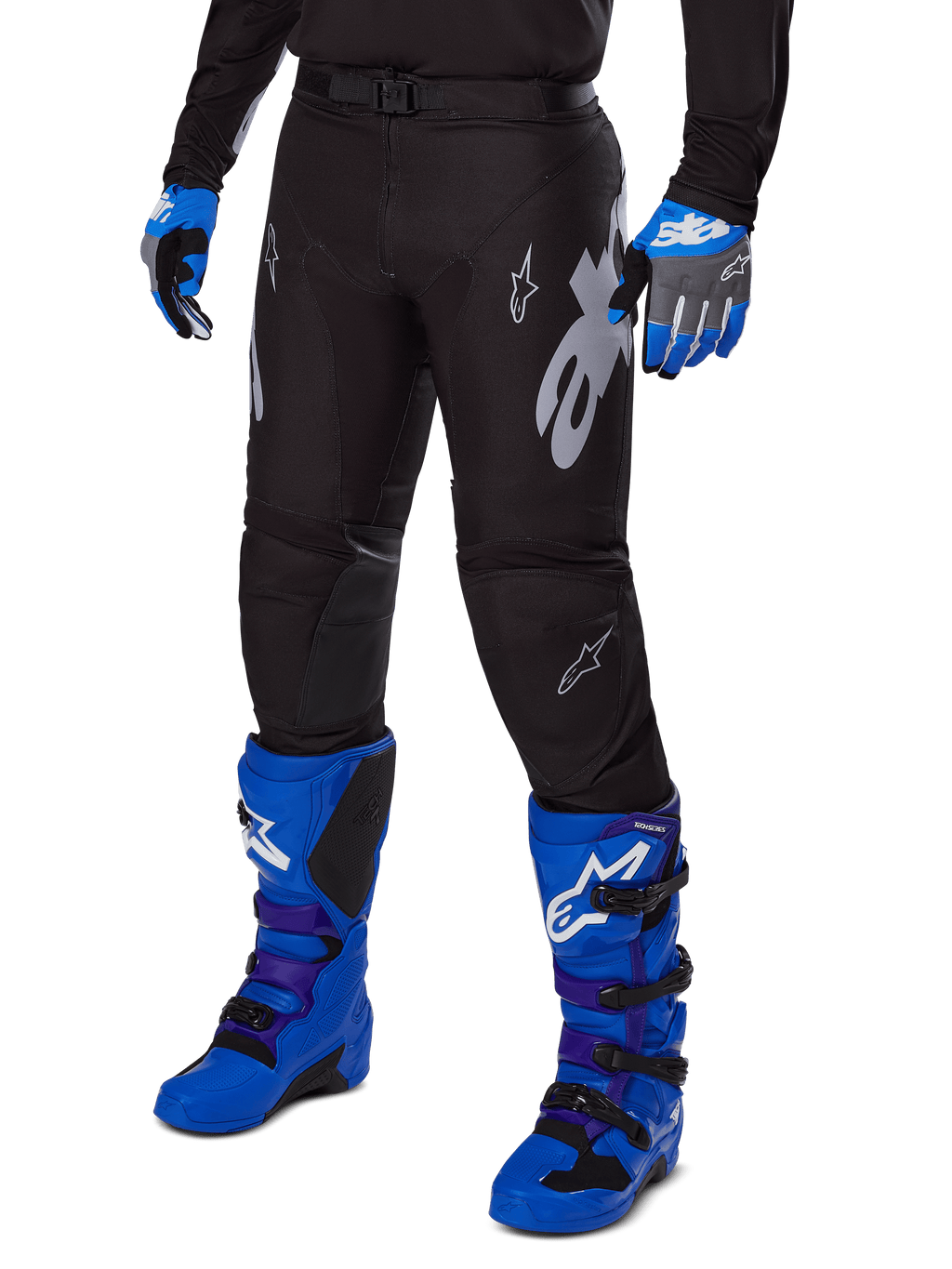 Alpinestars 2025 Racer Graphite Pants, Black Motocross Pants with white and gray graphics, worn with bright blue motocross boots and matching blue gloves, durable performance fabric for off-road riding