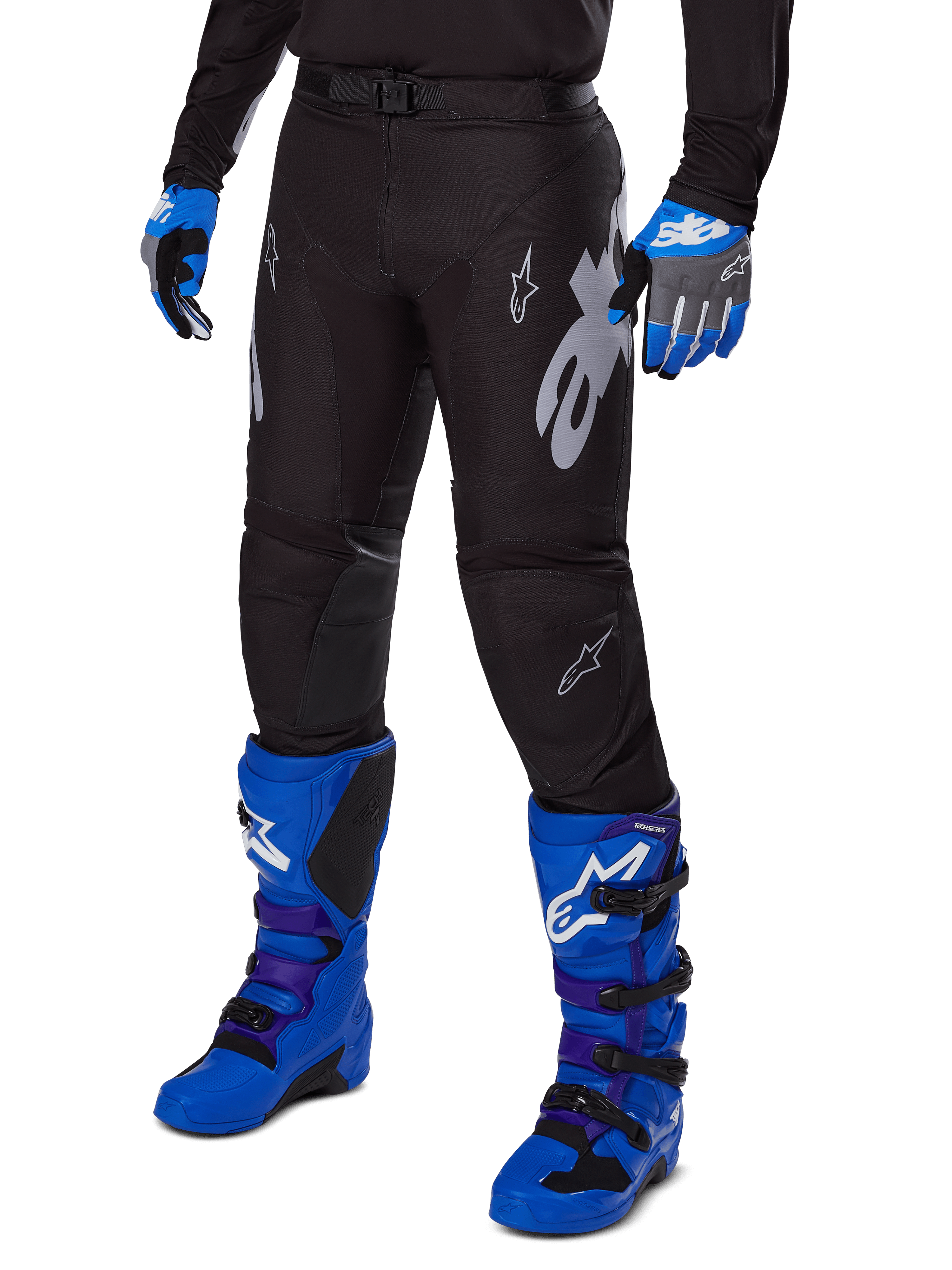 Alpinestars 2025 Racer Graphite Pants, Black Motocross Pants with white and gray graphics, worn with bright blue motocross boots and matching blue gloves, durable performance fabric for off-road riding