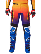 Alpinestars 2025 Fluid Wurx Pants, Motocross Pants, Multicolor featuring orange-to-purple gradient and blue panels, worn with matching blue and purple boots and red and black gloves, front view with star logo branding.