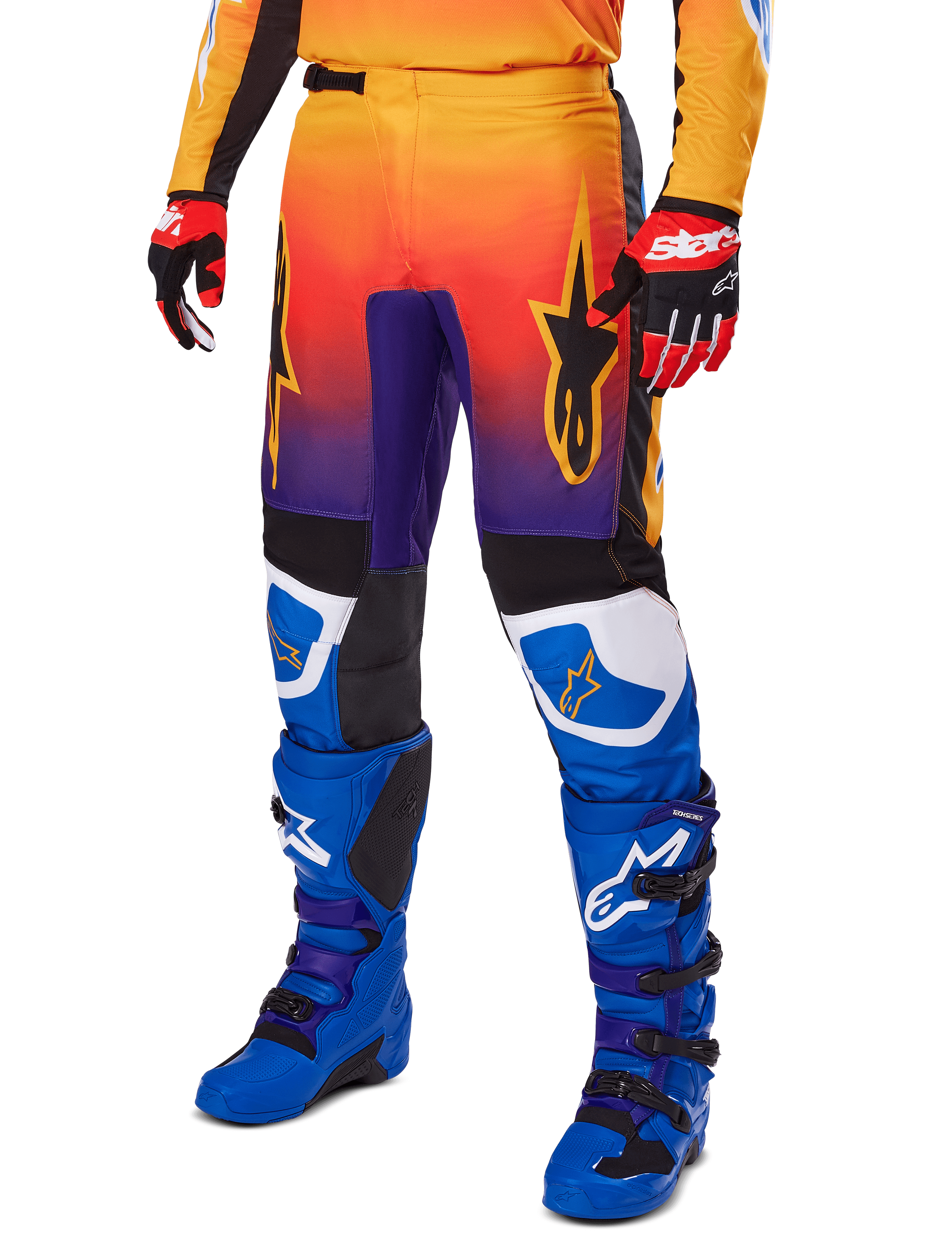 Alpinestars 2025 Fluid Wurx Pants, Motocross Pants, Multicolor orange red and purple gradient with black and blue panels, worn with blue boots and red gloves, featuring star logo graphics and white knee accents, durable performance gear for off-road racing