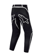 Alpinestars Fluid Apex V2 Hose, Motocross-Hose in Schwarz und Silber, Rückansicht mit verstärktem Sitzbereich und A-Stars Logo.
