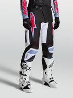 Alpinestars Fluid Drag Hose für Herren, Motocross-Rennsport-Hose in Schwarz und Weiß mit roten und blauen Akzenten.
