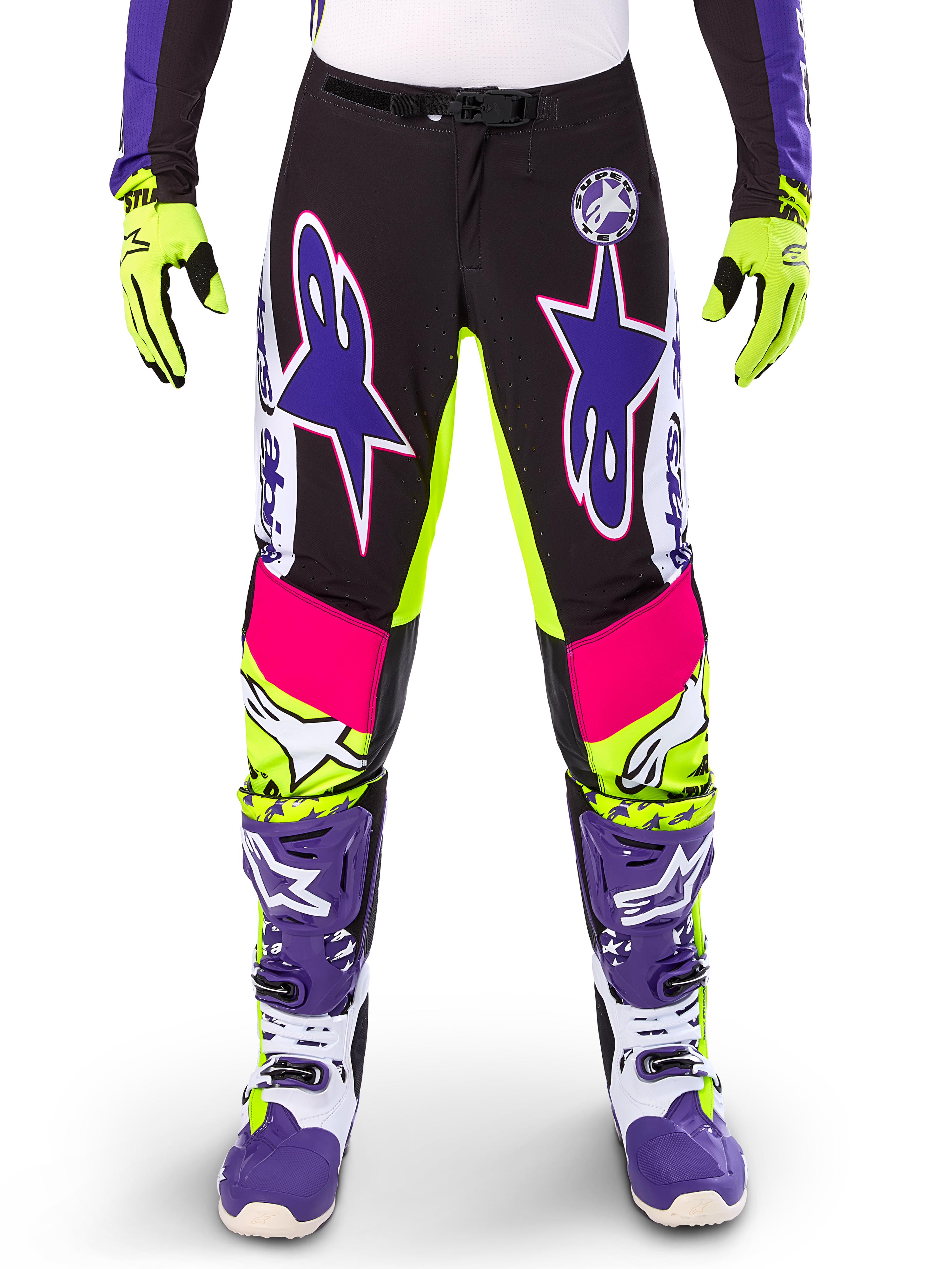 Alpinestars Limited Edition Supertech Dirt Studios Hose, Motocross-Hose, Weiß, Lila und Neongelb, mit schwarzen Einsätzen sowie neongelben und pinken Akzenten, große lila Stern-Logos, abgebildet mit passenden neongelben Handschuhen und lila Rennstiefeln, strapazierfähige Offroad-Rennbekleidung