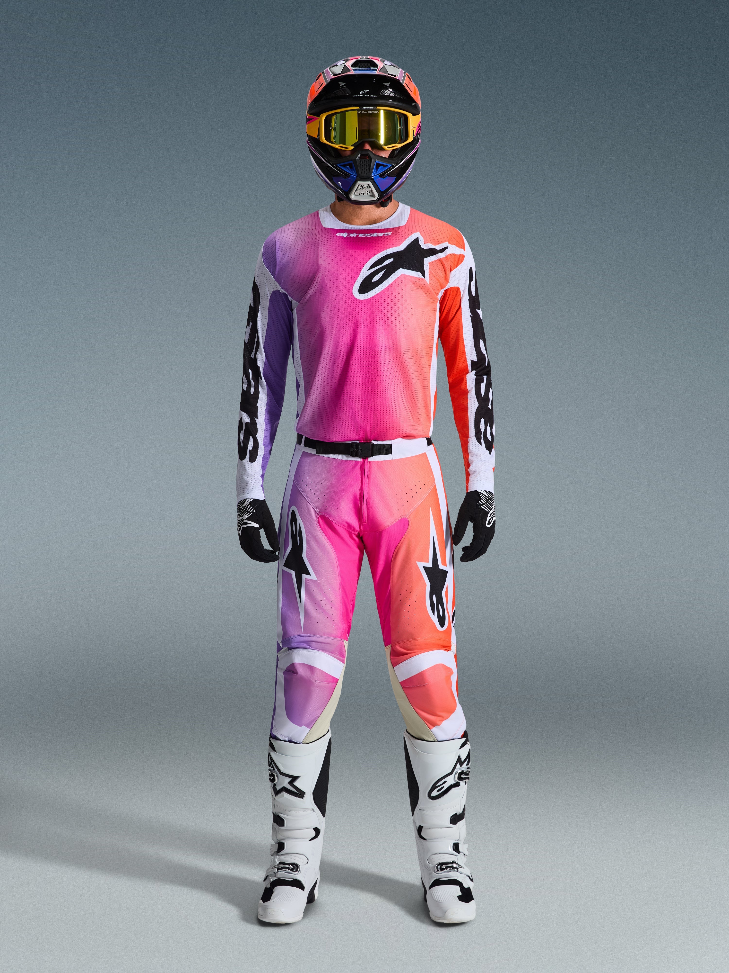 Alpinestars 2026 Racer Air Portl Gear Set, Motocross Gear, Pink Purple and Orange, complete outfit with matching helmet, yellow goggles, black gloves, and white boots, featuring bold star logo branding on the chest and legs.