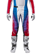 Alpinestars 2024 Techstar Pneuma Pants, Motocross Pants, Blu Mars Red White, featuring a multi-colored angular design with purple accents, paired with white and black motocross boots and matching gloves, athletic racing fit for off-road performance