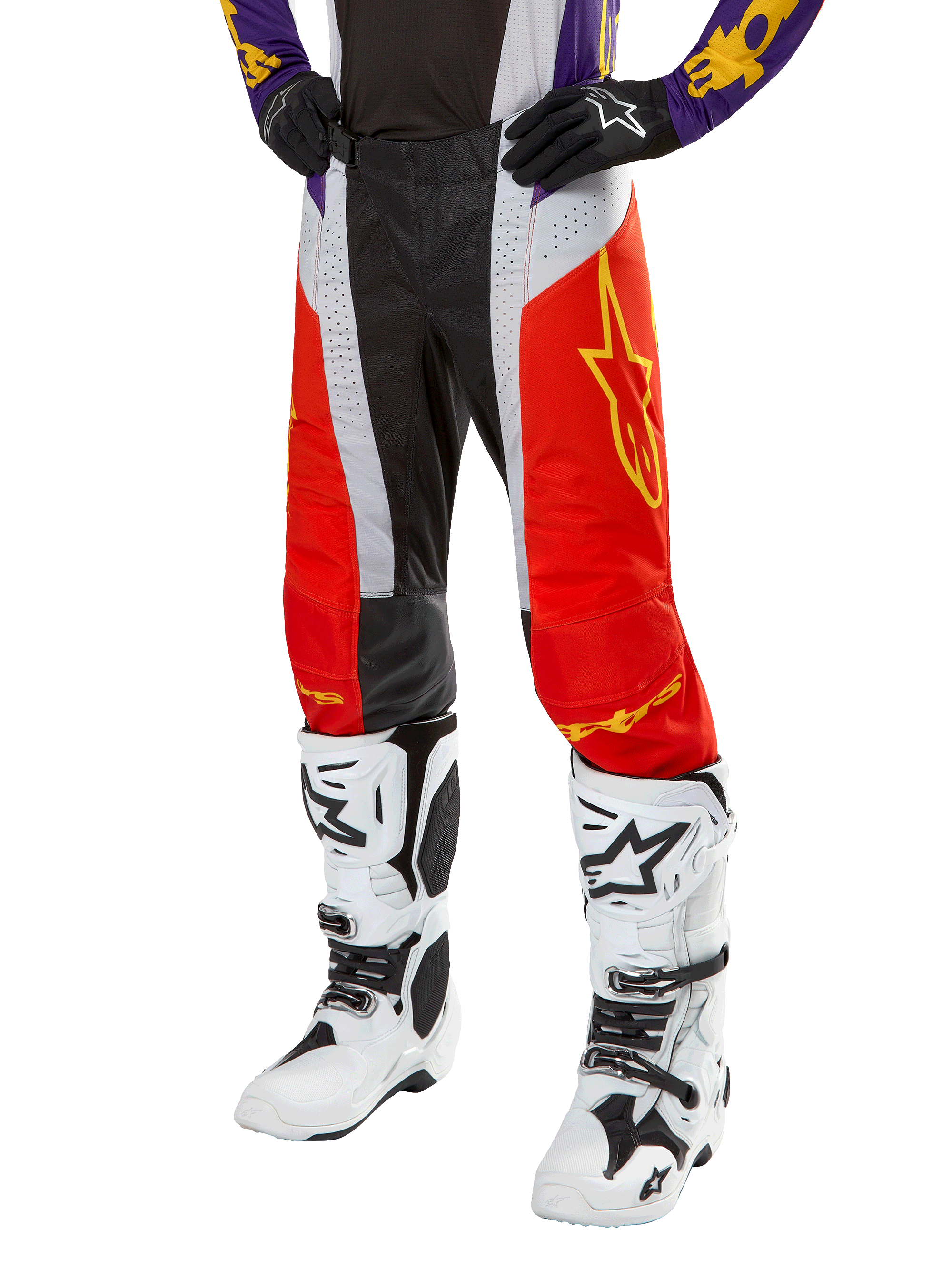 Alpinestars 2024 Techstar Ocuri Hose, Motocross-Hose, Hot Orange, Schwarz und Weiß mit gelber Sterngrafik, getragen mit lila Trikot und weißen Stiefeln, strapazierfähige Performance-Ausrüstung für den Offroad-Wettkampf