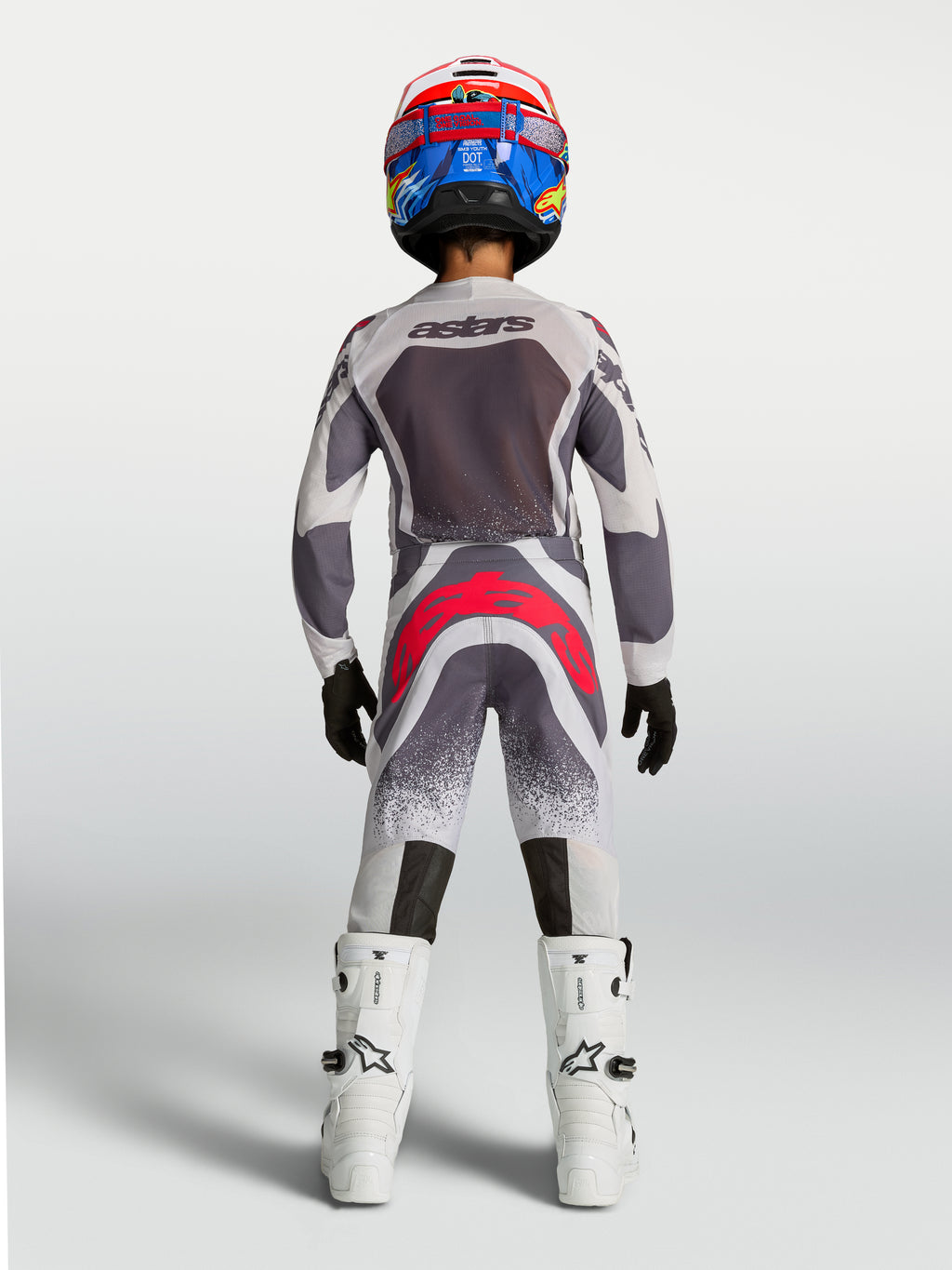 Alpinestars Jugend Supertech Swan Hose, Motocross-Rennbekleidung in Grau und Fluo-Rot, Rückansicht.