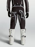 Alpinestars Jugend Fluid Apex V2 Hose, Motocrosshose in Schwarz und Silber mit ergonomischer Passform und großen Sternlogos.