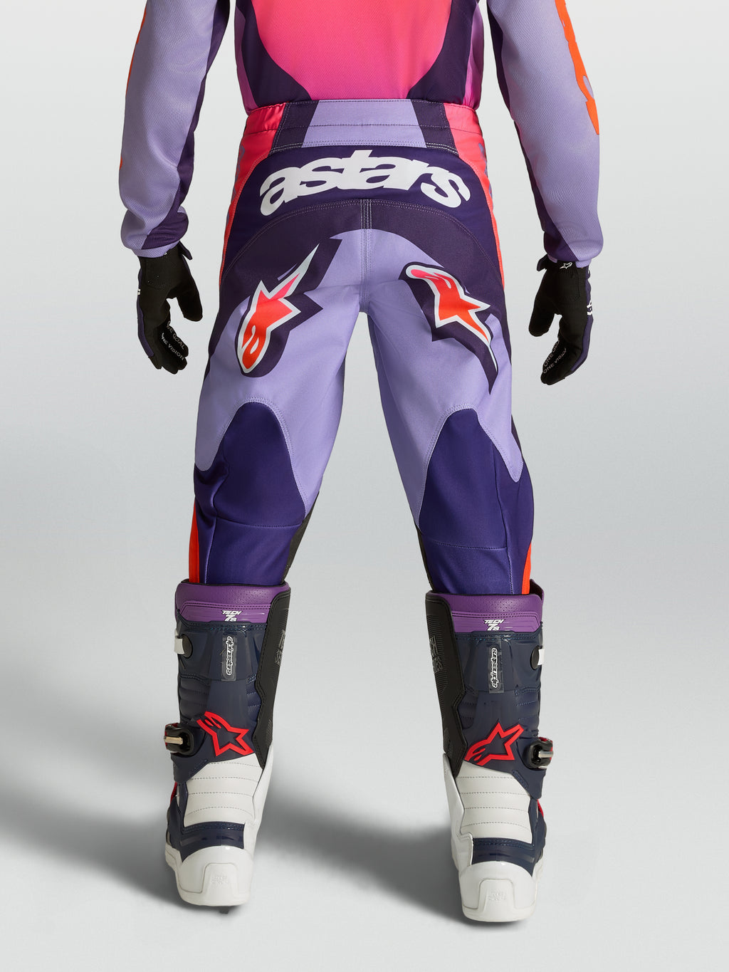 Alpinestars Fluid Hunt Jugend-Hose, lila-pinke Motocross-Hose mit Stern-Logos und strapazierfähiger Textilkonstruktion.