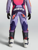Alpinestars Fluid Hunt Jugend-Hose, lila-pinke Motocross-Hose mit Stern-Logos und strapazierfähiger Textilkonstruktion.