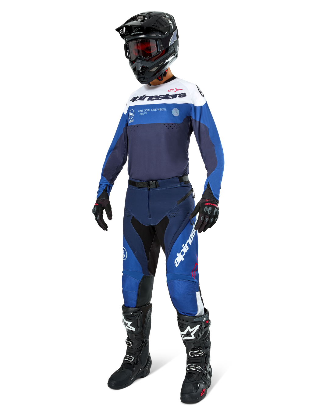Motocross rider wearing complete racing gear, Pro-Dura Jersey in Navy Bright Blue and White, matching blue and navy pants, black helmet with red goggles, black boots with white accents, and black gloves, coordinated outfit for enduro and off-road riding
