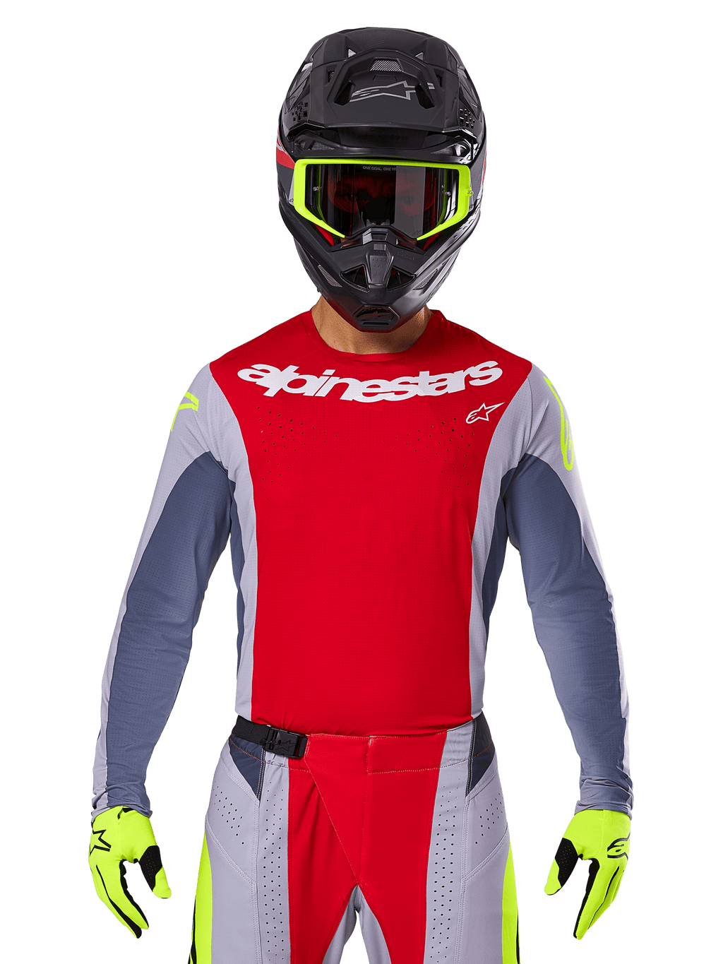 Motocross-Fahrer mit 2025 Techstar Melt Jersey und passender Hose, Hellrot und Grau mit weißem Alpinestars-Branding, schwarzer Helm mit neongelber Brille, passende neongelbe Handschuhe, belüftete Performance-Ausrüstung für Offroad-Rennen