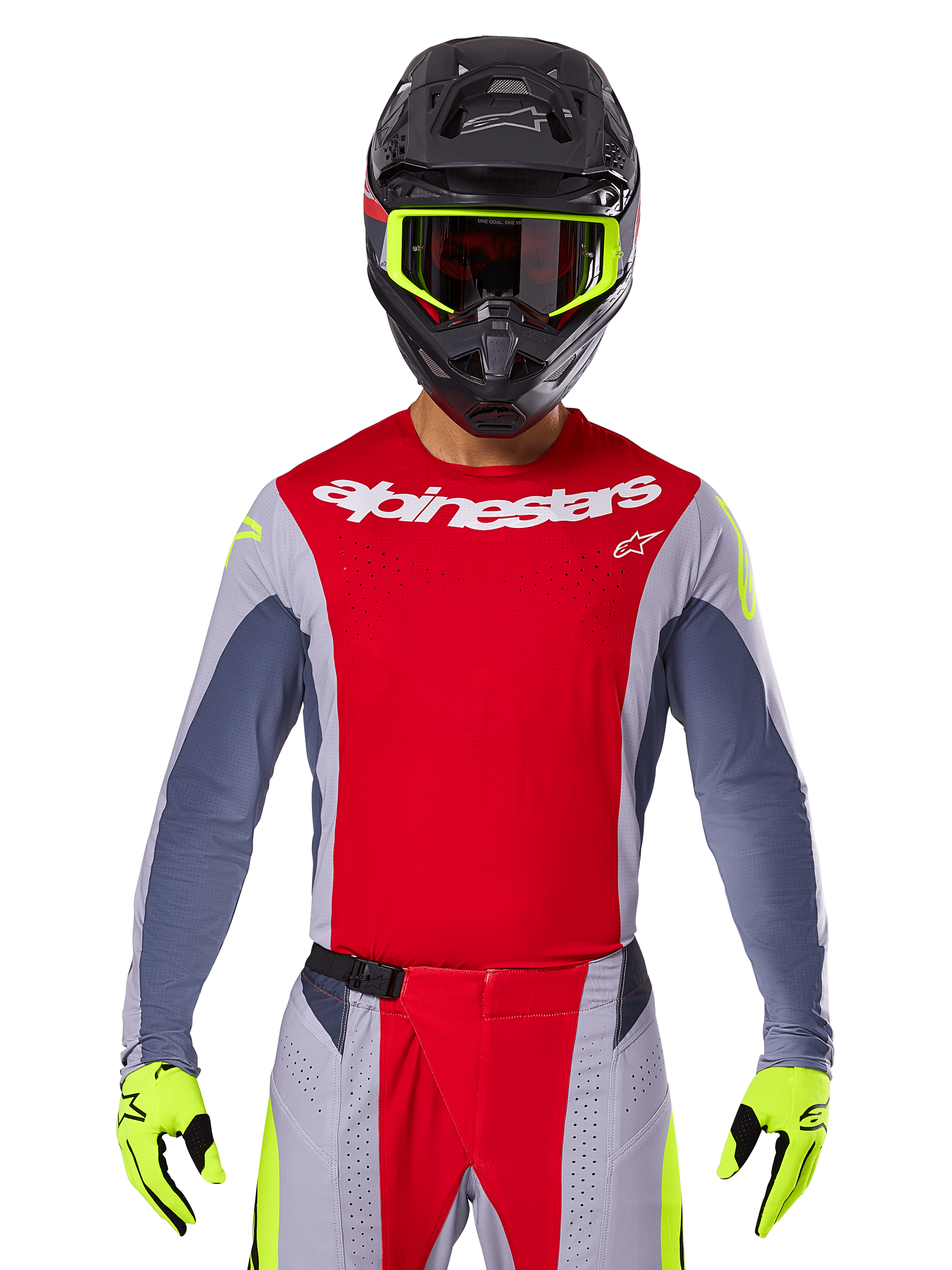 Motocross rider wearing 2025 Techstar Melt Jersey and matching pants, Bright Red and Gray with white Alpinestars branding, black helmet with neon yellow goggles, matching neon yellow gloves, ventilated performance gear for off-road racing