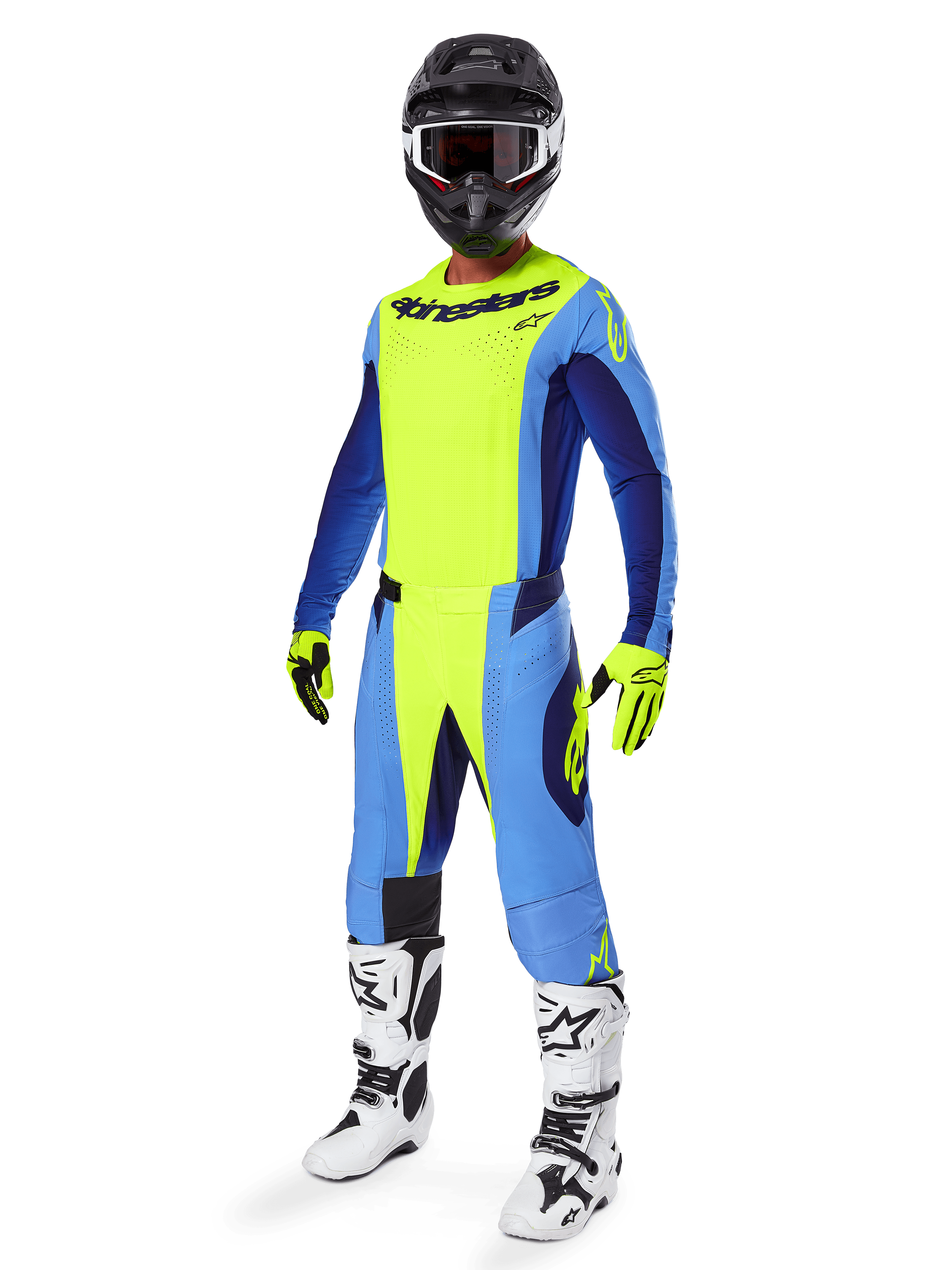Motocross-Fahrer im Alpinestars 2025 Techstar Melt Jersey, Gelb Fluo und Blau, kombiniert mit passender Hose, schwarzem Helm mit Goggles, gelben Handschuhen und weiß-schwarzen Stiefeln, komplette koordinierte Performance-Ausrüstung für Offroad-Rennen