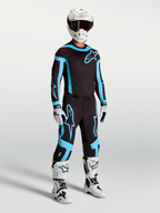 Alpinestars Supertech Vesta Trikot und Gear Set, schwarz-türkise Motocross-Ausrüstung mit athletischer Rennpassform.