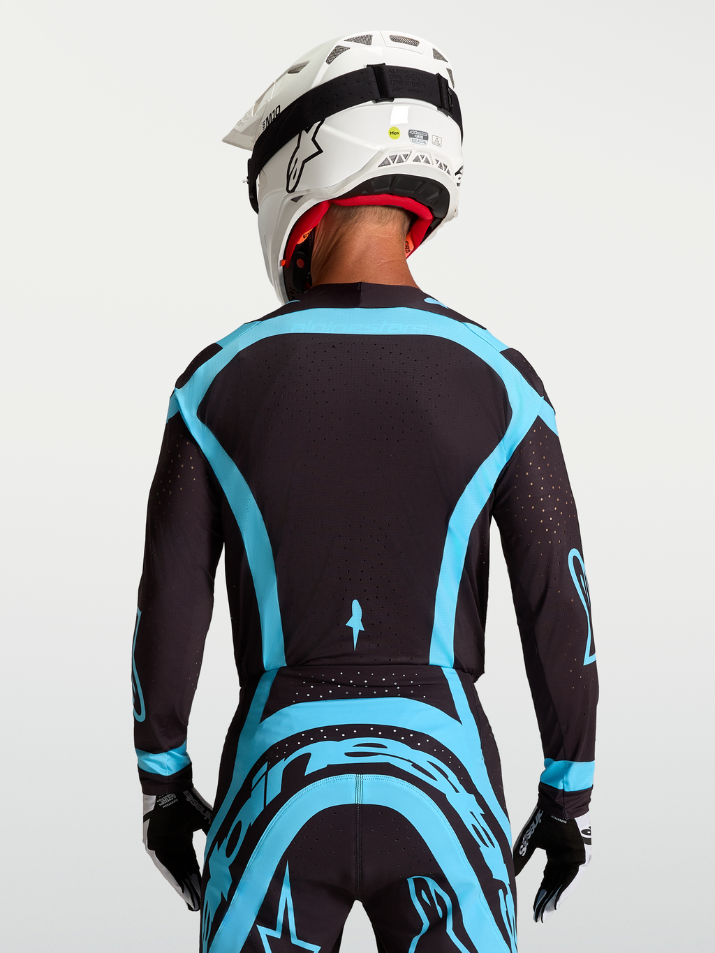 Alpinestars Supertech Vesta Trikot, Pro-Level Motocross-Jersey in Schwarz und Türkis mit atmungsaktivem Stretch-Mesh.