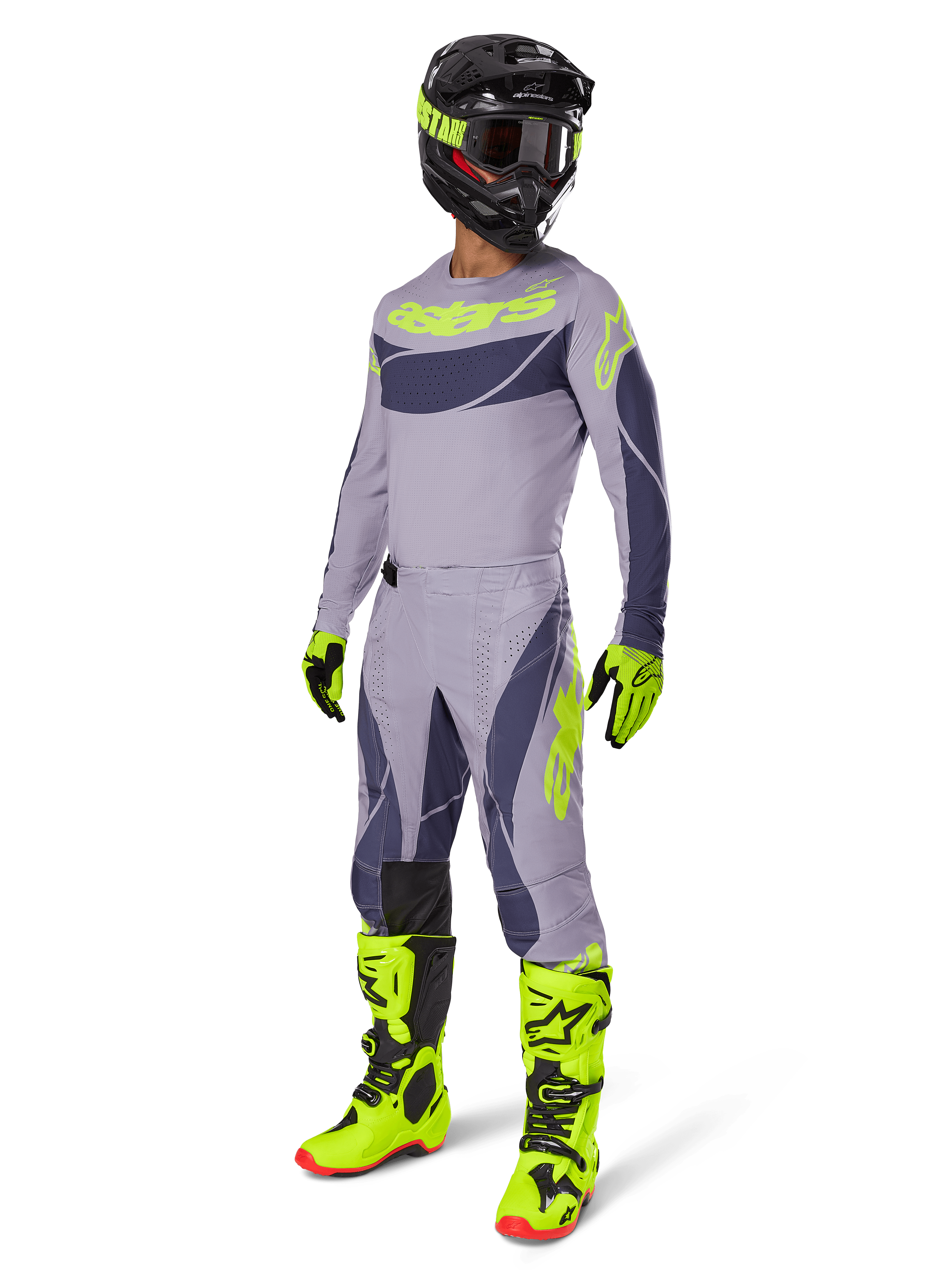 Motocross-Fahrer im 2025 Techstar Dreem Trikot in Grau und Dunkelgrau mit neongelben Akzenten, komplette Rennausrüstung mit passender grauer Hose, neongelben Stiefeln und Handschuhen sowie schwarzem Helm, abgestimmtes Offroad-Performance-Outfit