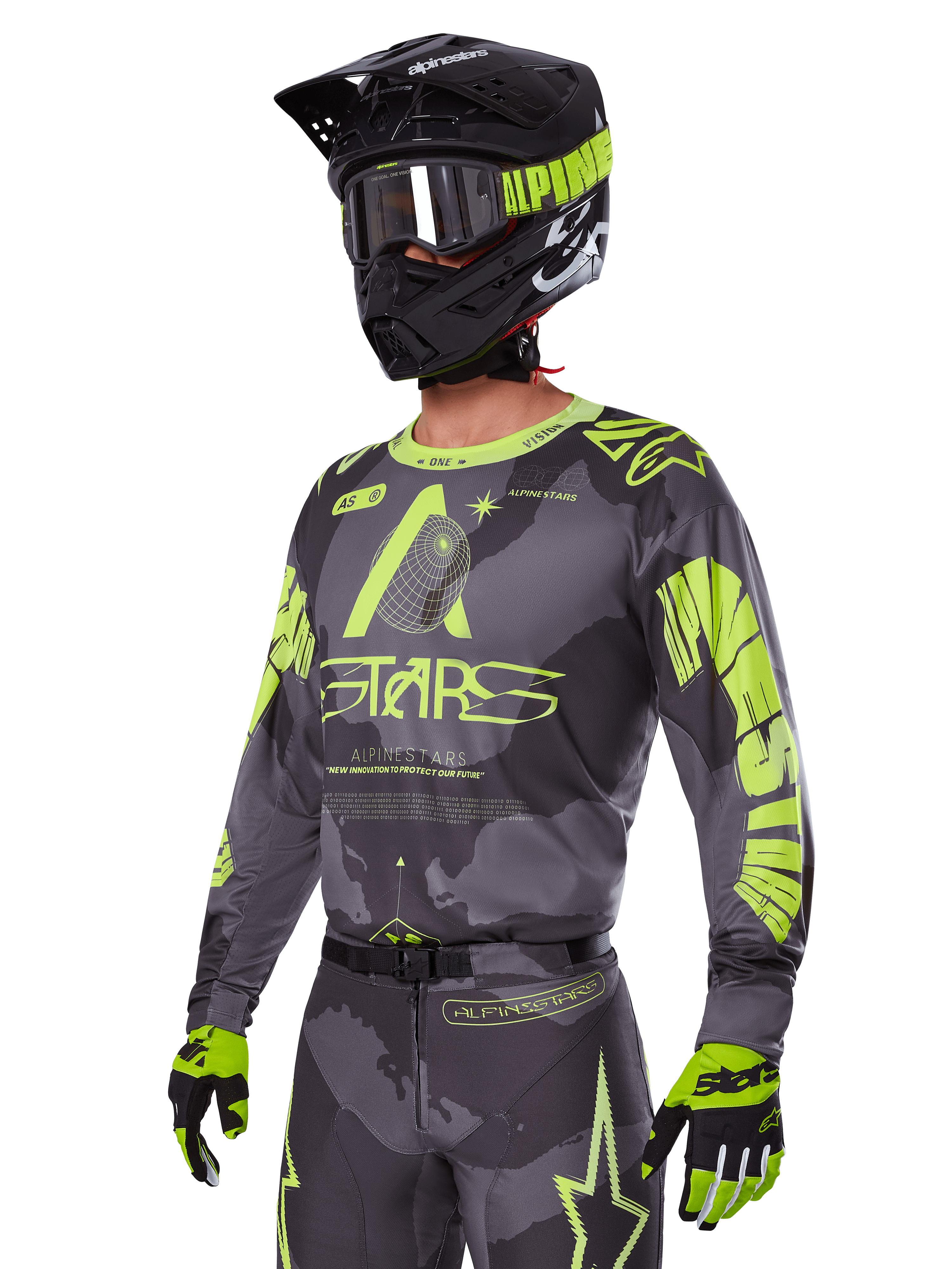 Alpinestars 2025 Racer Hollow Ausrüstungsset, Motocross-Jersey und -Hose in Grau und Neongelb, getragen mit passendem schwarzem Helm, Goggles und Handschuhen, mit markantem fluoreszierend gelbem Alpinestars-Branding und Stern-Grafiken auf einer gemusterten grauen Basis, koordinierter professioneller Offroad-Rennlook