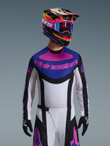 Alpinestars 2026 Techstar Knif Jersey, Motocross Jersey, Black Light Gray and Purple, pink Alpinestars logo on the chest, worn with matching colorful helmet and motocross pants, athletic race fit with laser-cut perforations for ventilation