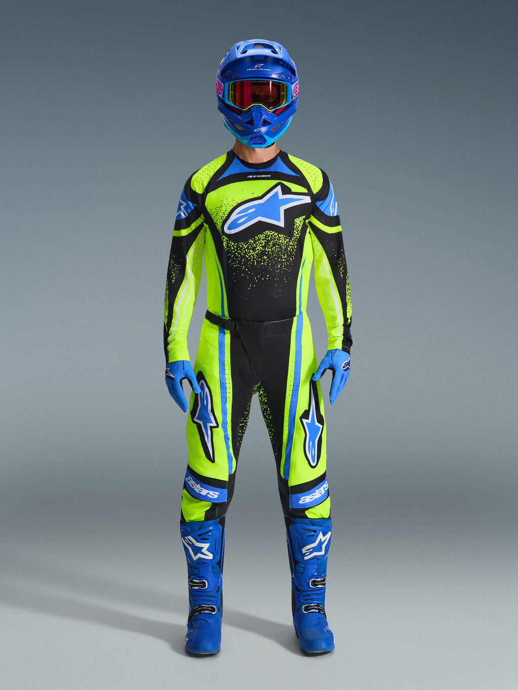 Alpinestars 2026 Techstar Nomur Gear Set, full motocross racing outfit, neon yellow and black with blue accents, complete gear set including helmet, gloves, and boots, athletic race fit with star graphics, professional MX protection