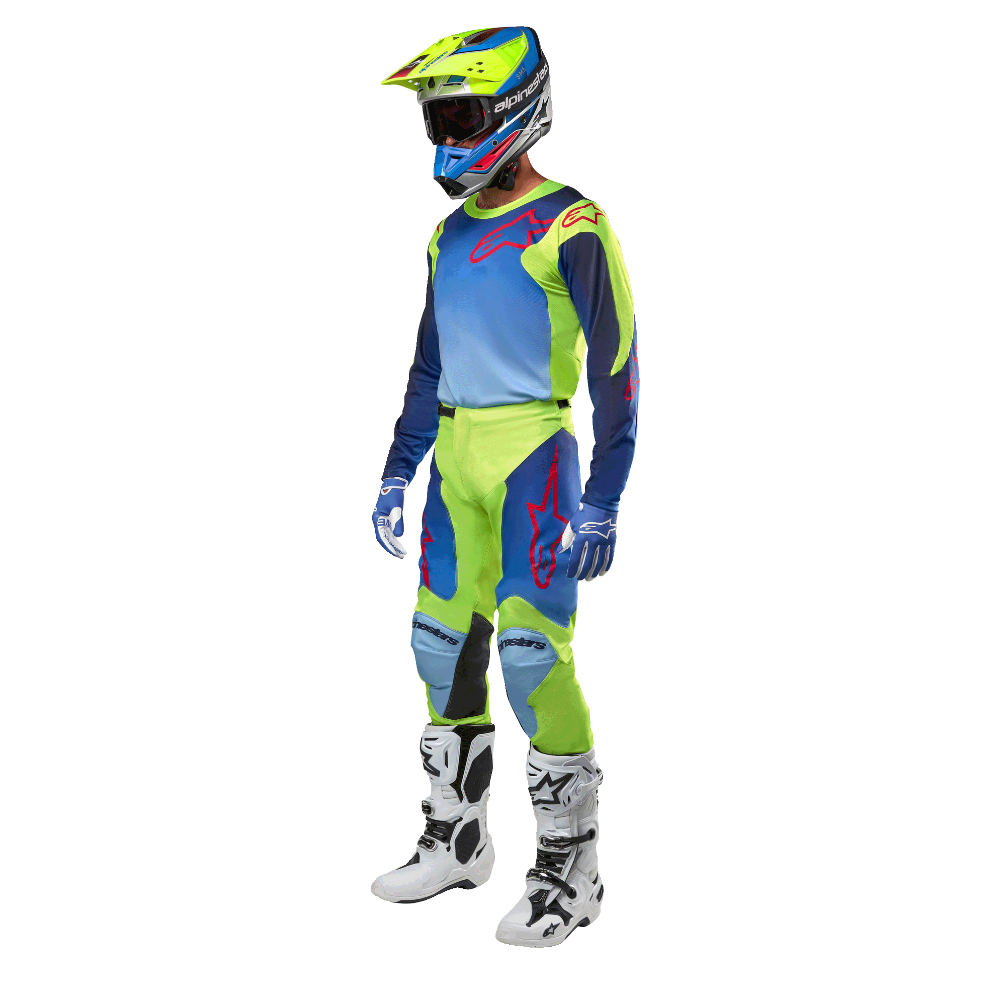 Alpinestars 2024 Racer Hoen Trikot, Motocross-Trikot, Gelb Fluo und Blau Night Navy, getragen von einem Fahrer mit passender Hose, Helm und weißen Stiefeln, professionelle Rennausrüstung für Offroad-Fahrten