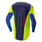 Alpinestars 2024 Racer Hoen Jersey, Motocross-Trikot, Gelb Fluo und Blue Night Navy, Rückansicht mit dunkelblauem Mittelteil und rotem Logo, leuchtend gelben Seitenbereichen, langen Ärmeln und atmungsaktivem Mesh-Gewebe für Offroad-Performance