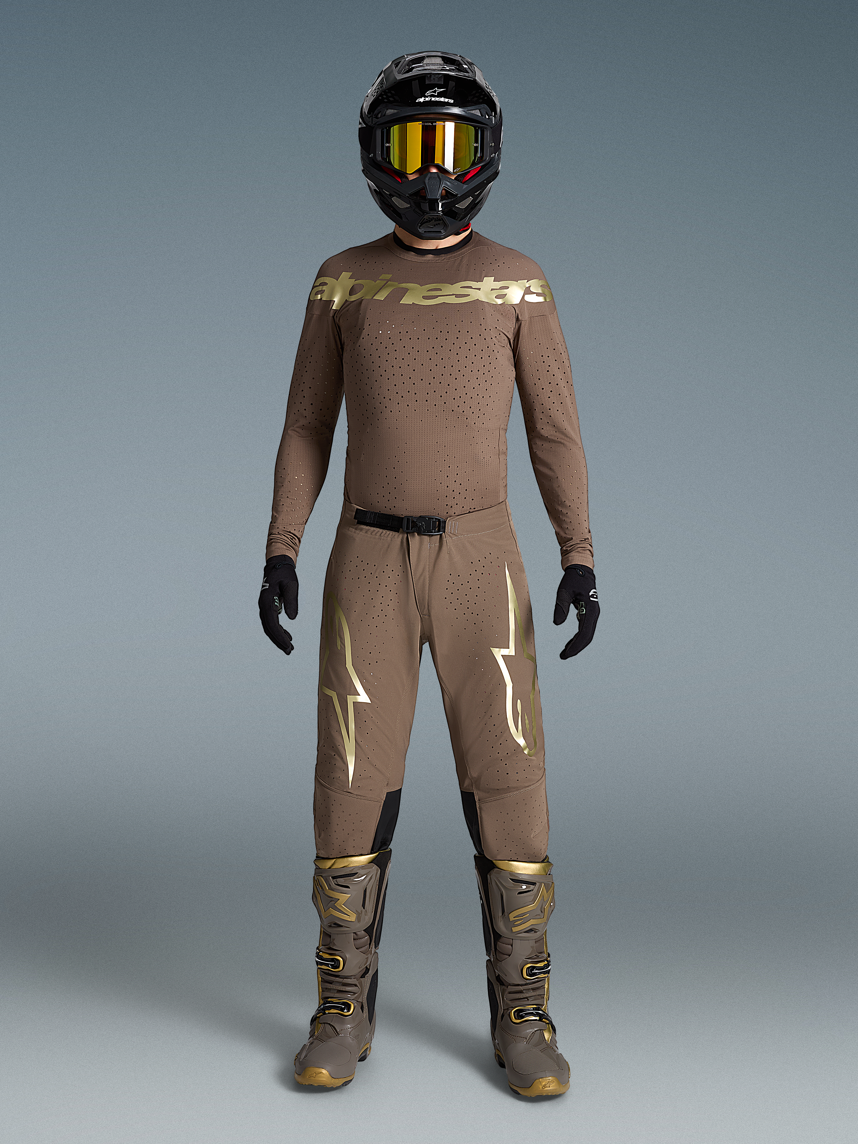 Alpinestars Limited Edition Supertech Air Gold Motocross Gear Set in Brown and Gold with ventilated mesh and athletic fit.