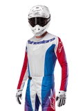 Alpinestars 2024 Techstar Pneuma Jersey, Motocross Jersey, Blue Mars Red and White with purple accents, athletic race fit, long sleeve performance gear worn with white helmet and gloves