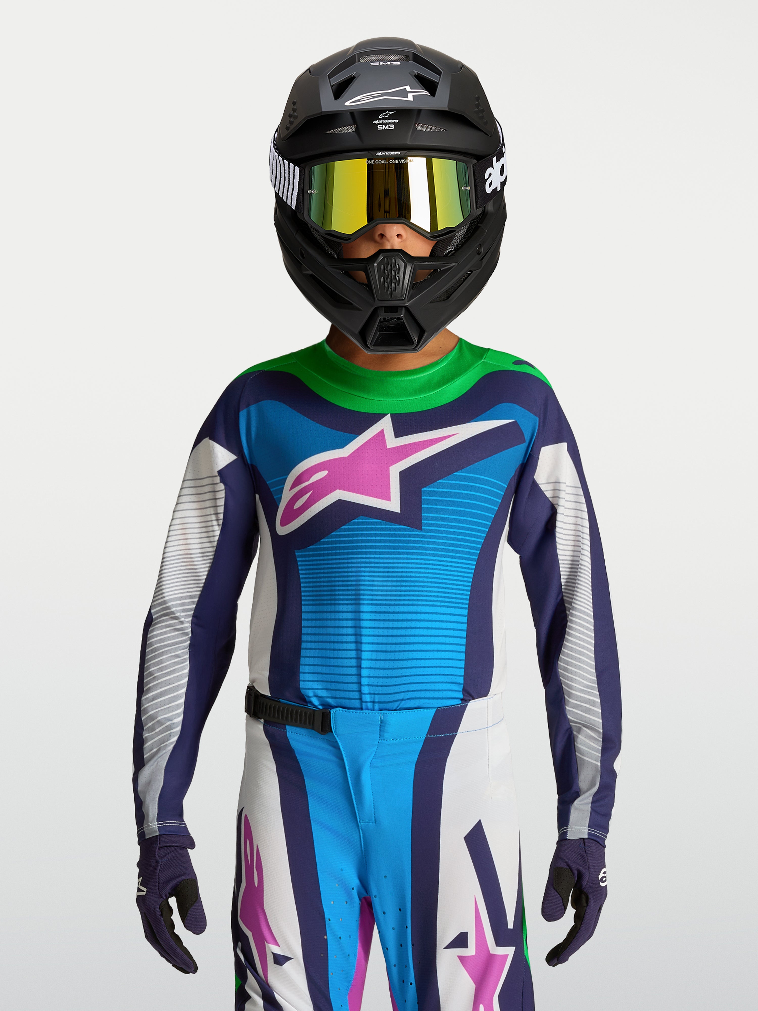 Alpinestars Supertech Maven Jugend-Trikot, blau-weißes MX-Rennsport-Trikot mit pinkem Logo und grünen Details.