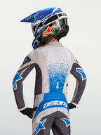 Alpinestars Fluid Jugend-Trikot Drag 2027, Motocross-Trikot für Kinder, Grau und Blau, feuchtigkeitsableitendes Funktionsmaterial, Rückansicht mit verlängerter Rückenpartie für Offroad-Einsätze.