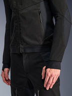 Alpinestars Troop-Air Pro Jacket in Black Black, close-up of technical armored air jacket featuring detailed 2D tech mesh construction, zippered pockets, and elasticated hem with Alpinestars branding, sleeves with integrated thumb loops, paired with matching motorcycle gear.
