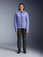 Alpinestars Woman Stella Chrome V2 Sport Hoodie, Blue Violet with white Astars logo on the chest, full-zip technical fleece with hood, worn with black motorcycle pants and riding boots, casual urban riding gear for women