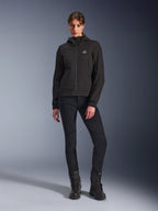 Alpinestars Stella Radium Tech Hoodie in Black, Women's urban motorcycle tech shell, worn with black slim-fit pants and black boots, featuring a small chest logo and hood, lightweight windproof construction for urban riding