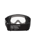 Alpinestars Vision Goggles OTG, Motocross-Brille, Schwarz und Grau, Rückansicht mit breitem schwarzem gewebtem Brillenband und Markenslogan, mehrschichtiger grauer Gesichtsschaum, klare Sichtscheibe, konzipiert für das Tragen über einer Korrekturbrille