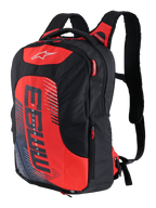 MM93 City Hunter V2 Backpack, Black and Red, sporty motorcycle backpack with ergonomic padded shoulder straps, multiple compartments with red zipper pulls, bold red front panel with MM93 logo and Marc Marquez graphic elements, durable polyfabric, sleek streamlined design