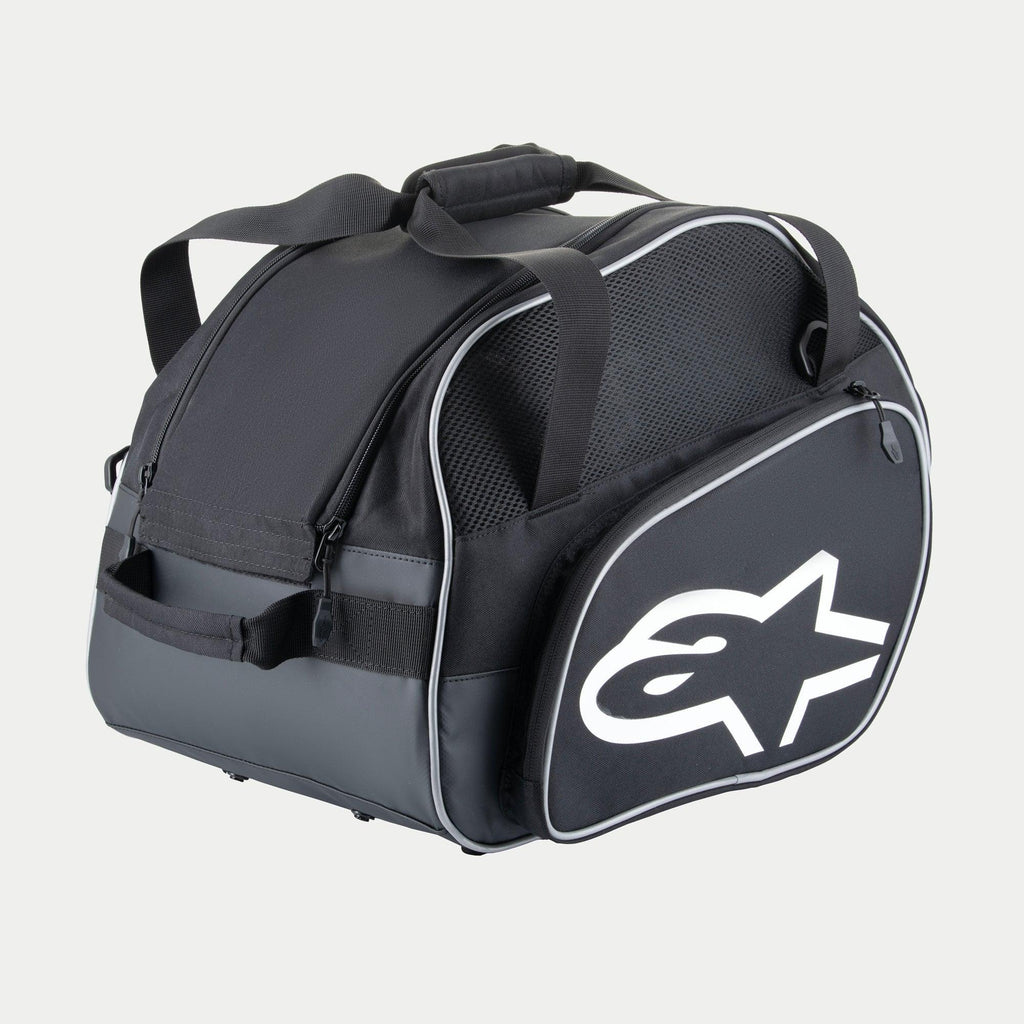 Alpinestars Flow V3 Helmet Bag, Protective Storage for Full-Face Helmets, Black and White, featuring a large white logo on the side, mesh ventilation panels, and reinforced grab handles, durable polyester design for racing gear.