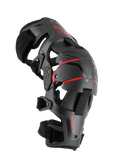 Alpinestars RK-1 Plasma Knee Brace, Motorcycle Knee Protection, Black and Red, side profile view featuring the articulated four-point hinge system, triple segmented knee cup, and adjustable straps for off-road racing