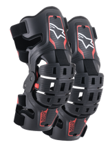 Alpinestars Youth Bionic 5S Knieorthesen, Motocross-Knieschutz, Schwarz und Rot, Paar Protektoren mit Hybrid-Rahmendesign und belüfteten Schalen, weißes Astar-Logo oben, rotes ASTARS-Branding unten und verstellbare schwarze Riemen für sicheren Halt.