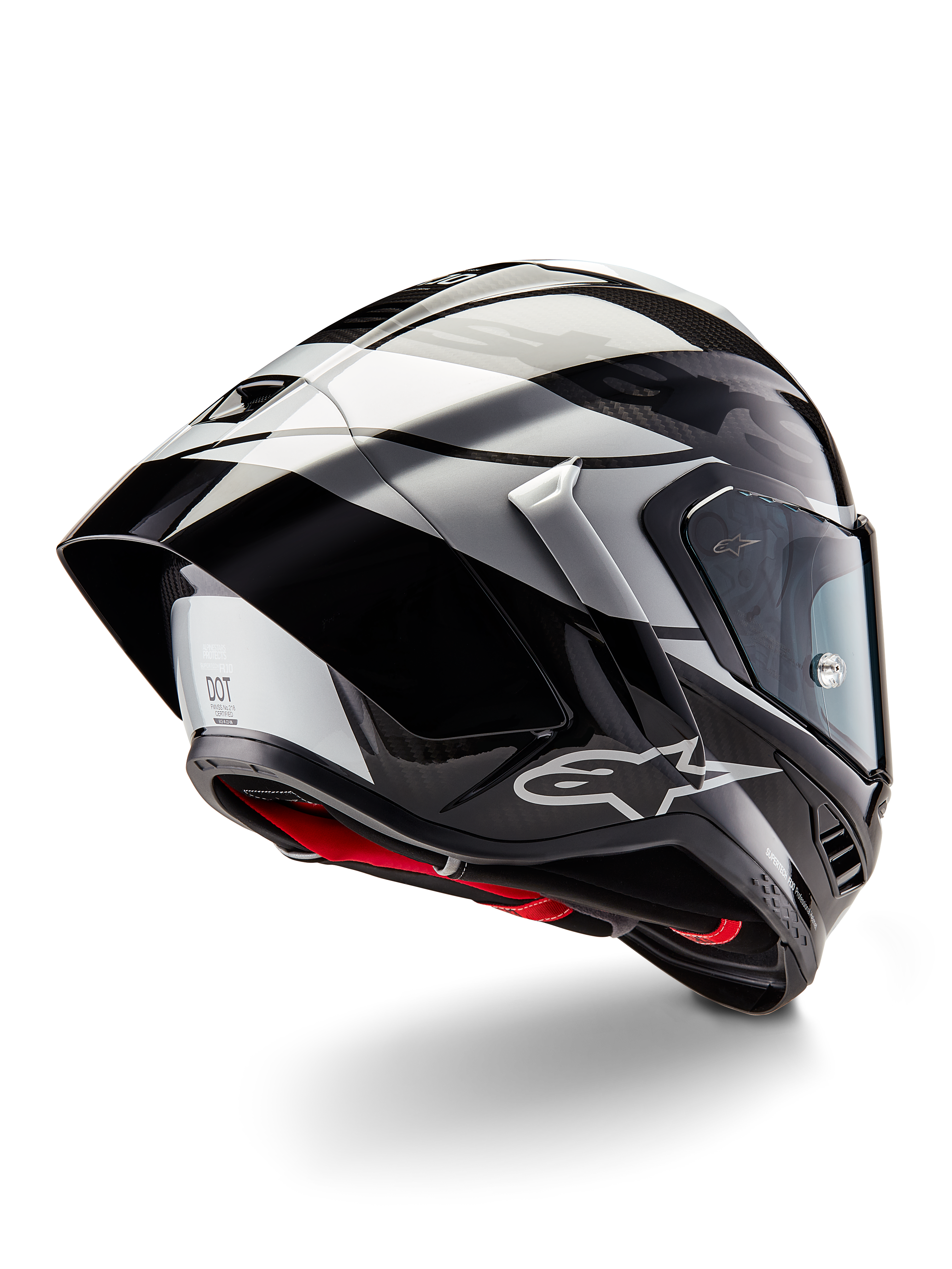 Alpinestars Supertech R10 Element Helmet, Black Carbon Silver Black Glossy, rear three-quarter view showing aerodynamic racing profile, glossy carbon fiber shell with geometric grey and black graphics, Alpinestars logo, and red interior padding