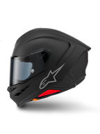 Alpinestars S-R7 Solid Helm, Integral-Motorradhelm, Mattschwarz, Seitenansicht, mit silbernem Astars-Logo auf der Seite, aerodynamisches Design mit integriertem Spoiler und Kinnbelüftung sowie roten und orangefarbenen Akzenten an der Basis