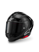 Alpinestars S-R7 Solid Helmet, Black Glossy, full-face motorcycle helmet with carbon composite shell, white star logos on forehead and side, aerodynamic design with integrated spoiler and ventilation ports
