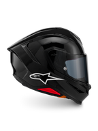 Alpinestars S-R7 Solid Helmet, Full-Face Motorcycle Helmet, Black Glossy, profile view featuring a white A-star logo, streamlined aerodynamic shell with integrated spoiler and red accents at the base, designed for racing and sport performance.