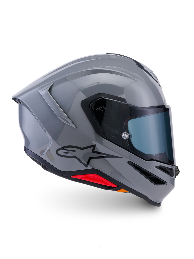 Alpinestars S-R7 Solid Helm, Integral-Motorradhelm, Grau glänzend, Seitenprofilansicht, glänzend graue aerodynamische Schale mit schwarzem Logo und roten Akzenten an der Basis, Hochleistungs-Rennsport- und Sport-Fahrausrüstung