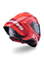 Alpinestars Supertech R10 Arius Helmet, Glossy Red with white branding, Rear three-quarter view showing aerodynamic spoiler, carbon fiber shell construction, and sleek racing profile with a dark visor