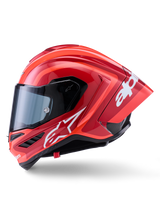 Alpinestars Supertech R10 Arius Helm, Integral-Rennhelm, Glänzendes Rot mit weißen Logo-Grafiken, Seitenprofilansicht mit Fokus auf den aerodynamischen Spoiler und das klare Visier, Carbon-Multi-Composite-Schale für den professionellen Motorsport