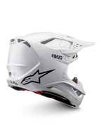 Alpinestars Supertech M10 Solid Helm ECE 22.06, weiß glänzender Motocross-Helm mit schwarzen Grafiken, roten Akzenten, Belüftungsöffnungen und Schirmvisier