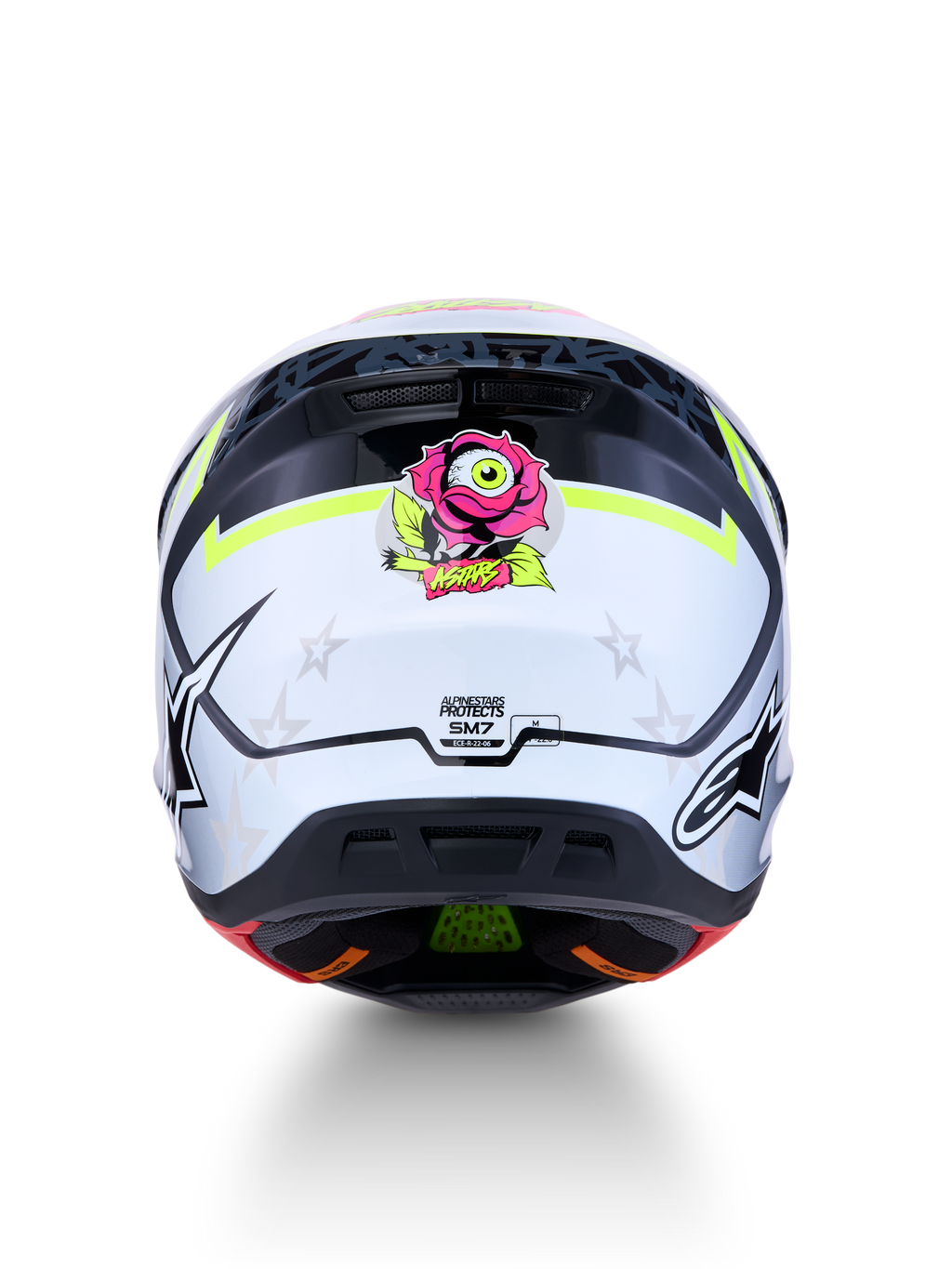 Alpinestars S-M7 Blaster Motocross-Helm, Rückansicht, Weiß-Schwarz mit gelben Akzenten, pinke Rosengrafik, ECE-zertifiziert.