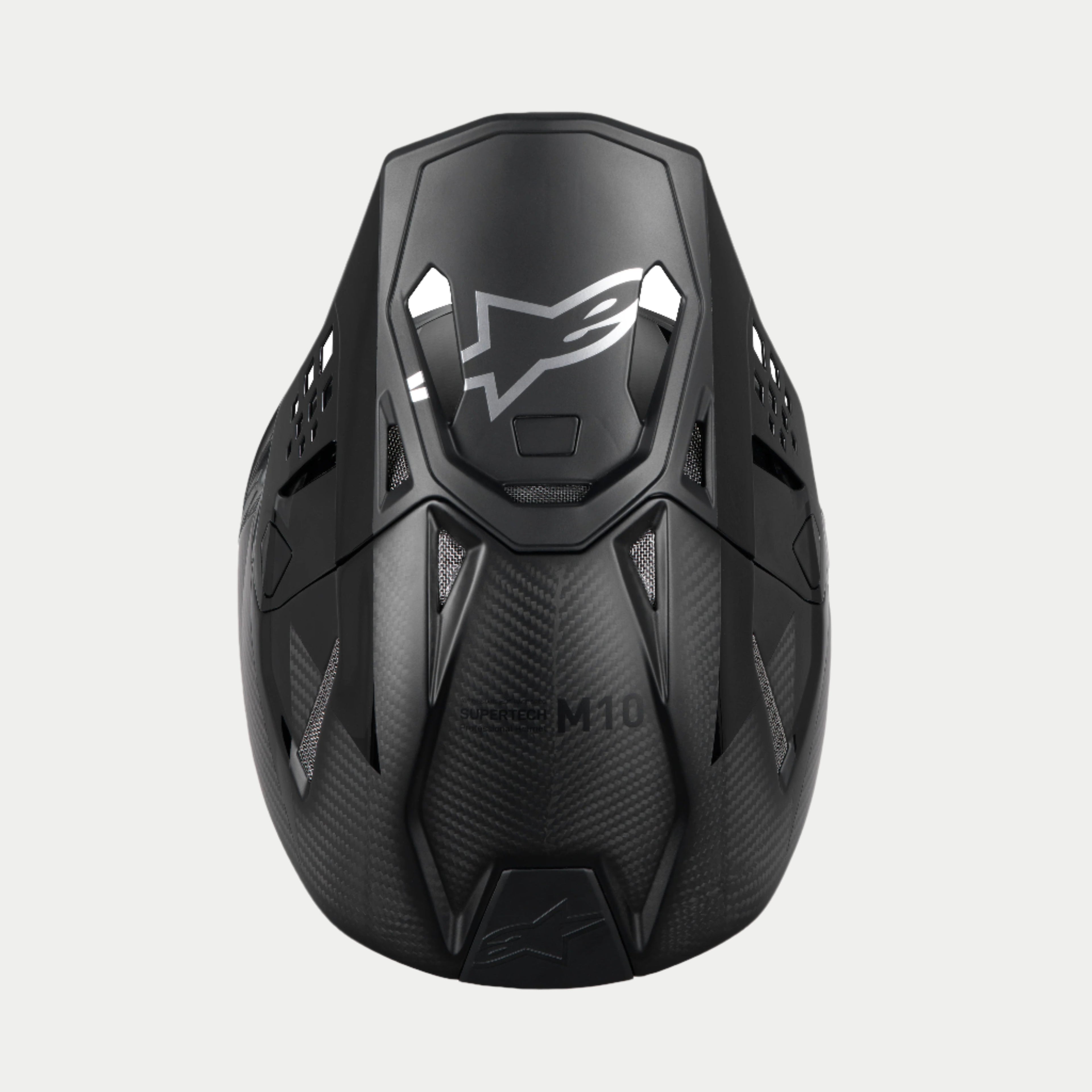 Alpinestars Supertech M10 Fame ECE 22.06 Helmet, Motocross Helmet, Black Carbon Matte and Glossy, top-down view highlighting the carbon fiber weave, aerodynamic visor with silver Alpinestars logo, and multiple ventilation ports for off-road racing.